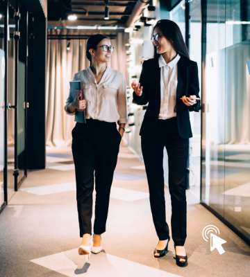 Image of 2 high-net-worth entrepreneurs in a hallway
